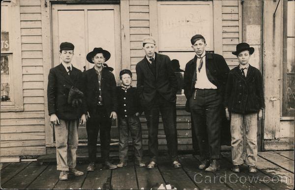 Group of Young Men and Boys Standing on a Porch Children