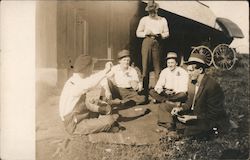 Four Men Sitting on the Ground Playing Cards Postcard