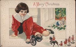 A Merry Christmas - A Young Boy Playing with Toys Postcard