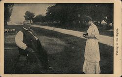 A Woman with a Camera Taking a Picture of a Man Postcard