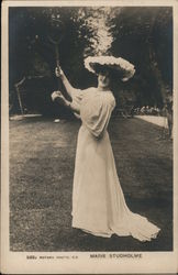 A Woman Holding a Tennis Racket Up Postcard Postcard Postcard