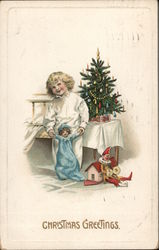 Christmas Greetings - A Girl with a Doll Postcard
