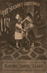 The Season's Greetings - Playing Santa Claus Postcard