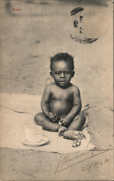 A small child sitting alone South Africa