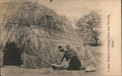 A Zulu Woman Grinding Corn and Nursing Baby Postcard