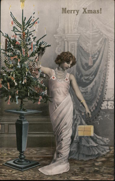 Merry Xmas! - lady in elegant gown next to small Christmas tree
