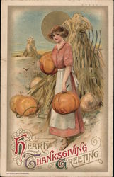 Hearty Thanksgiving Greeting - Woman in Pumpkin Patch, Holding Pumpkins Postcard