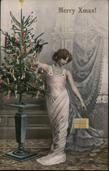 Merry Xmas! - lady in elegant gown next to small Christmas tree Postcard