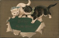 2 illustrated kittens tearing up gift wrap to find the greeting "With best New Year Wishes" beneath Postcard