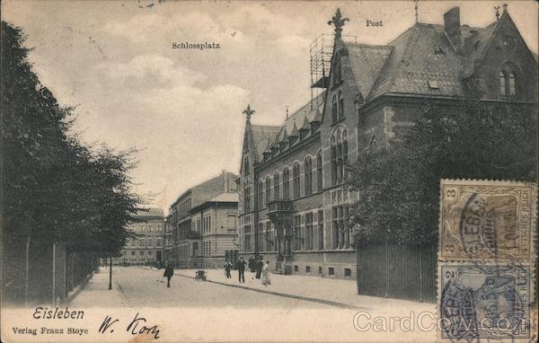 People walking in the street near a German castle Eisleben Germany