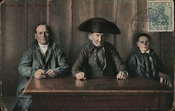 Two men and a boy in traditional German attire Postcard