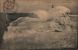 A lighthouse with crashing waves Postcard