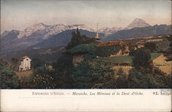 View of a church and the mountains in Evian Postcard