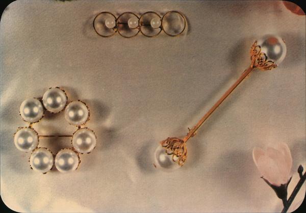 Pearl and gold pins Advertising