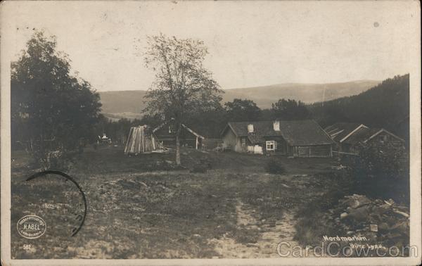 A homestead with several buildings on a plot of land overlooking a mountain Lyse Norway
