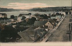 Houses and a street along the coastline Postcard