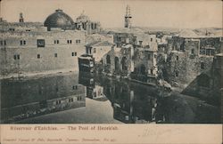 A dry reservoir surrounded by buildings with towers and domes Postcard