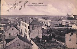 A bird's eye view of rooftops and towers Postcard