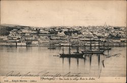 Many houses and building built along a harbor with boats Postcard