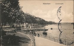 People boating and walking along a pier Postcard