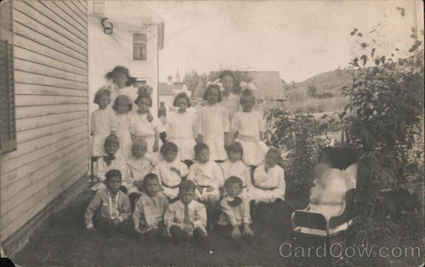 A Group of Children Gathered Outside a House