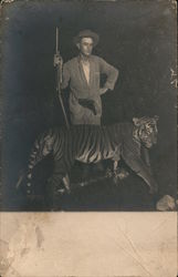 Man with gun, standing with tiger Tigers Postcard Postcard Postcard