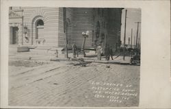 S.W. Corner of Post Office Showing Where Ground Sank After the Shock Postcard