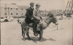 Two Men Riding a Donkey Postcard