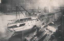 The death ship Eastland once more afloat but with the dangerous list to port still in evidence Postcard