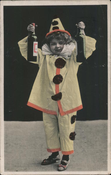 Boy in clown costume holding bottles Circus