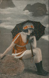 Woman in Orange with Umbrella Sitting on Beach Postcard