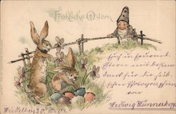 Troll leaning over a fence watching rabbits hiding colored eggs. Postcard