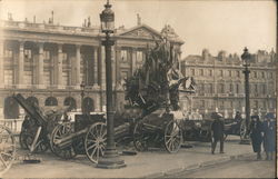 Cannons left at a statue with bystanders Postcard
