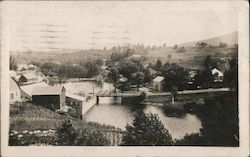 Small town with bridge over a river Postcard