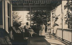 Women Reading on Porch Postcard