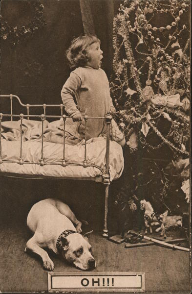 A Little Kid in Bed Next to a Christmas Tree Children