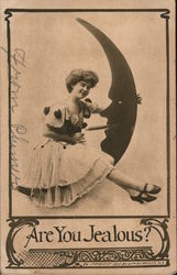 Are you Jealous? Girl sitting on man in the moon lighting his cigar. Postcard