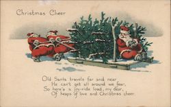 Christmas Cheer - Two Santas Pulling a Sled with Christmas Trees and Another Santa Santa Claus Postcard Postcard Postcard