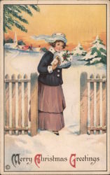 Merry Christmas Greetings - A Woman Walking Through the Snow Postcard