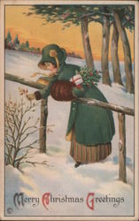 A Woman in the Snow Picking Holly Postcard