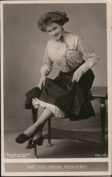 Are you from Missouri? - Woman sitting on table Postcard