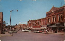 Main Street and Business District, looking west Postcard