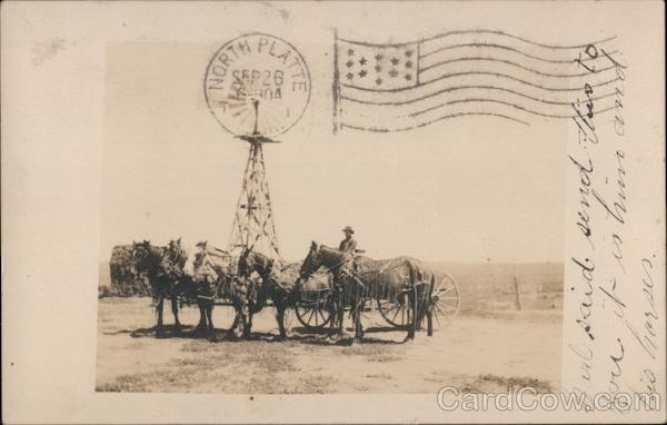 Man with five horse and wagon. Windmill Sutherland Nebraska