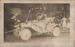 Deer head on front of car decorated with flowers for parade Postcard