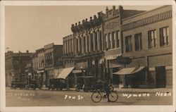 7th Street, Hargrave Clothing, Drug Store, Bicycle, Cars Postcard