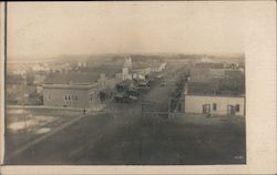 Aerial view of main street. Horse and wagons Postcard