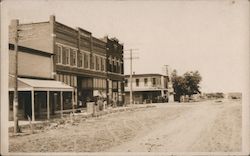 Main street view with dirt road of Western, Neb Postcard