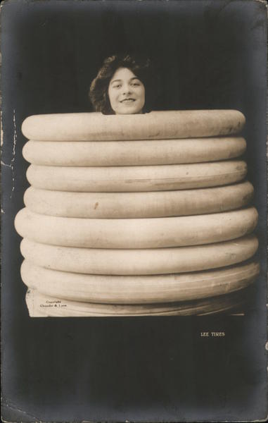 Lee Tires - Woman in Stack of Tires Advertising
