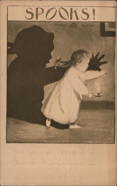 Child making large shadow on a wall with a candle Halloween
