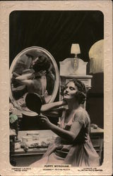 Poppy Wyndham looking in Mirror Postcard